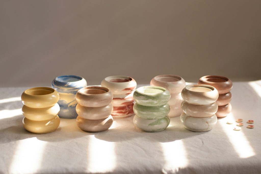 Multiple cups all with the same bubble design, each a different color with a marble effect